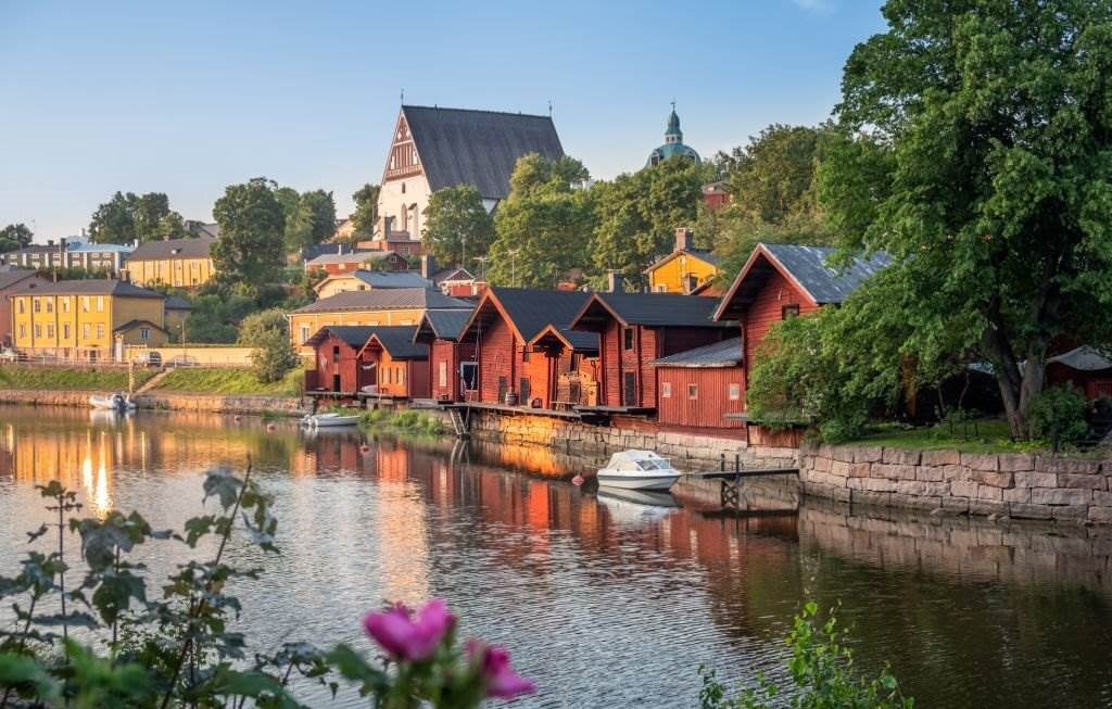 Houses By Lake And Buildings Against Sky - Photo Taken In Porvoo, Finland - Places to Visit in Finland - Planet Travel Advisor