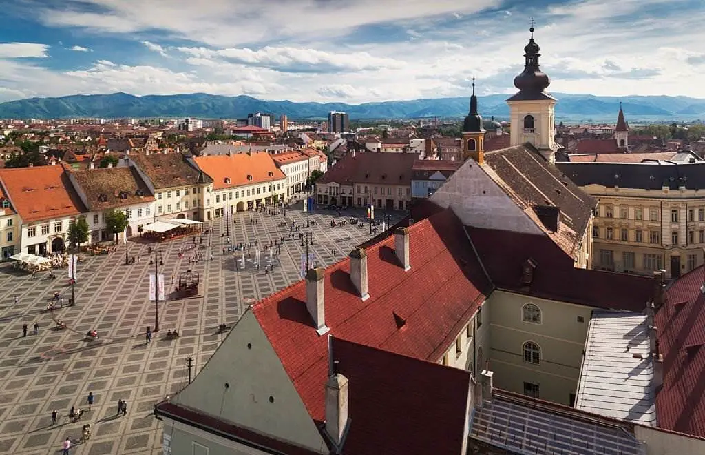 Romania, Transylvania, Sibiu, Piata Mare Square, elevated view - Best Places to Visit in Europe - Planet Travel Advisor Romania, Transylvania, Sibiu, Piata Mare Square, elevated view - Best Places to Visit in Europe - Planet Travel Advisor