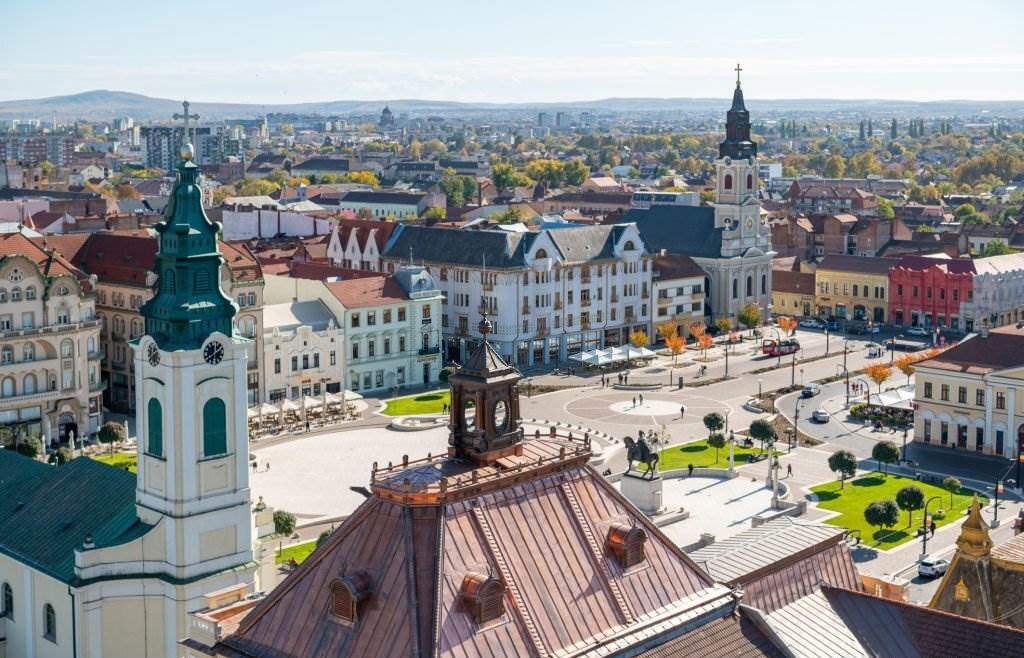 Oradea Aerial view from the city hall tower over Oradea town center with historic buildings and churches - Best Time to Visit Europe - Planet Travel Advisor