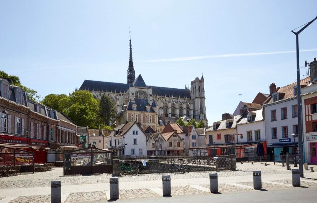 the cathedral of Amiens is the largest one in France. View from the typical district of the Hortillonnages - Best Time to Visit Europe - Planet Travel Advisor