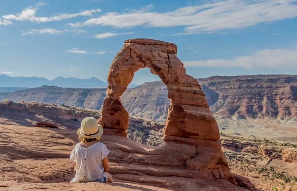 Arches National Park (U.S) - Little girl observing the Delicated Arch, Arches National Park, Utah, United States - Natural Attractions in USA - Planet Travel Advisor