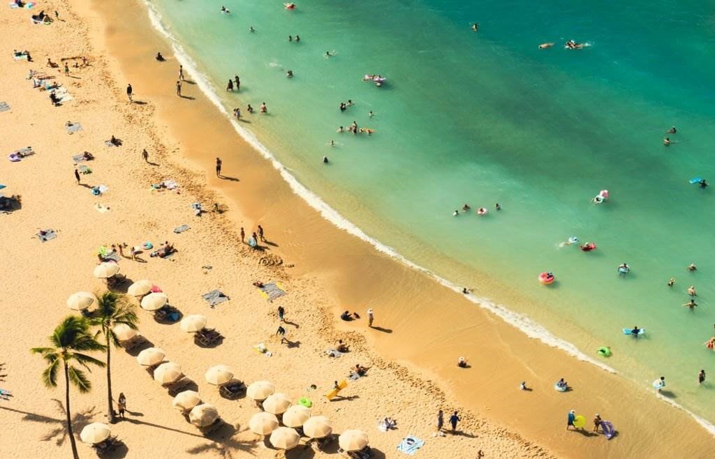 High Angle View Of A Tropical Beach in Hawaii With People - Crowds in Hawaii in May - Planet Travel Advisor