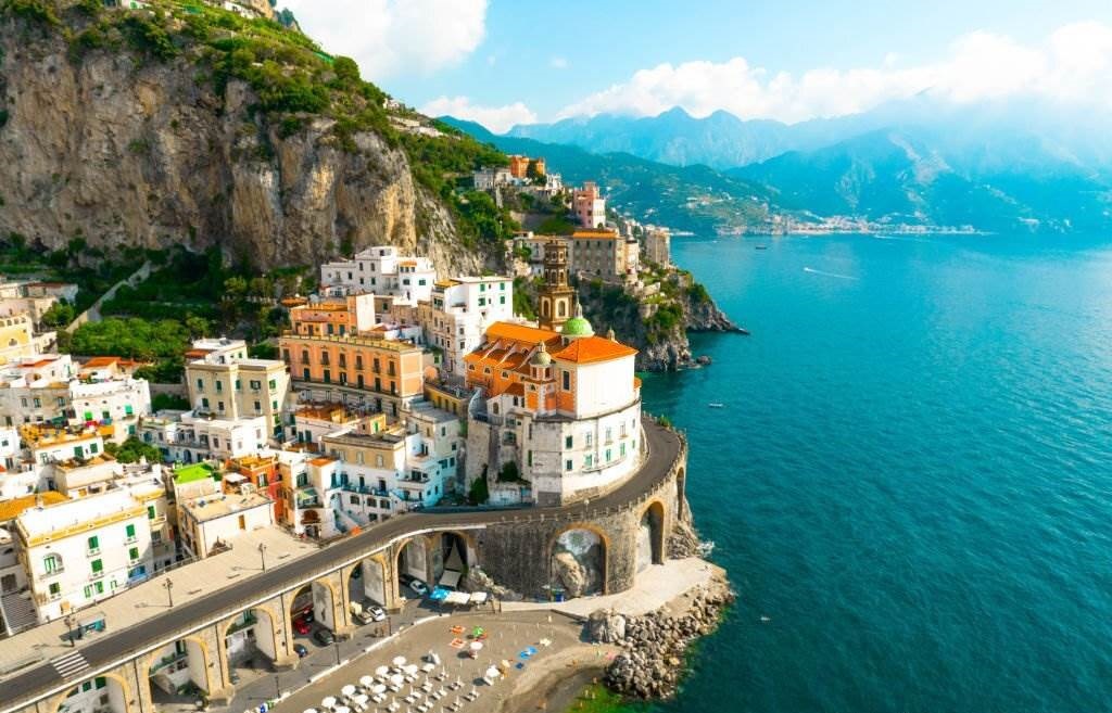 Aerial view of the stunning Amalfi coast with road and the Atrani town with arched road in Italy - Best 5 Countries to Visit in 2023 With Tips - Planet Travel Advisor