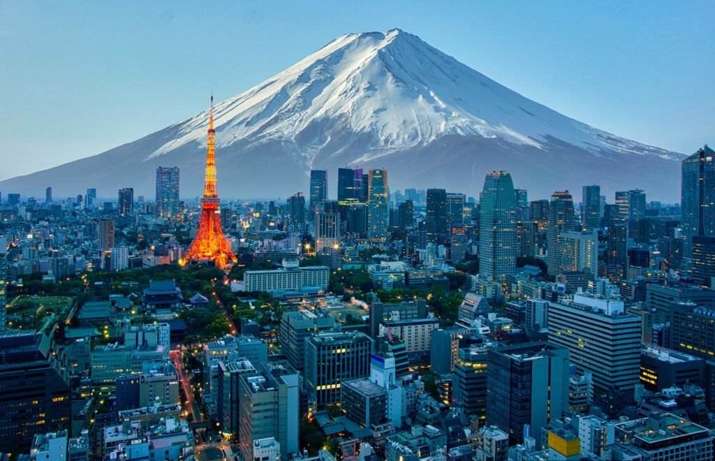 Mt. Fuji and Tokyo skyline - Best 5 Countries to Visit in 2023 With Tips - Planet Travel Advisor