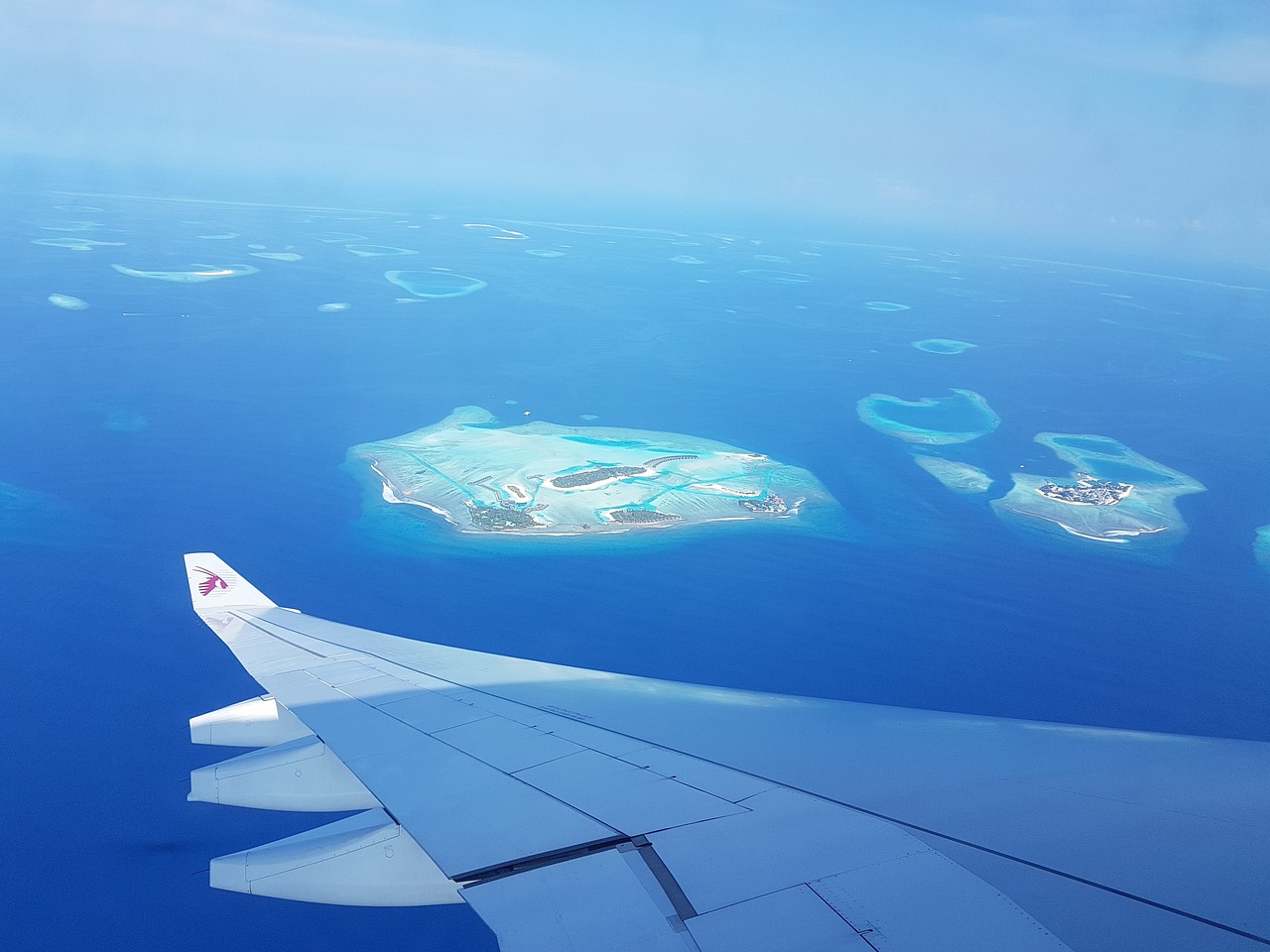 Sky View from a Plane Flight Over Maldive Island - Best Time to Visit Maldives