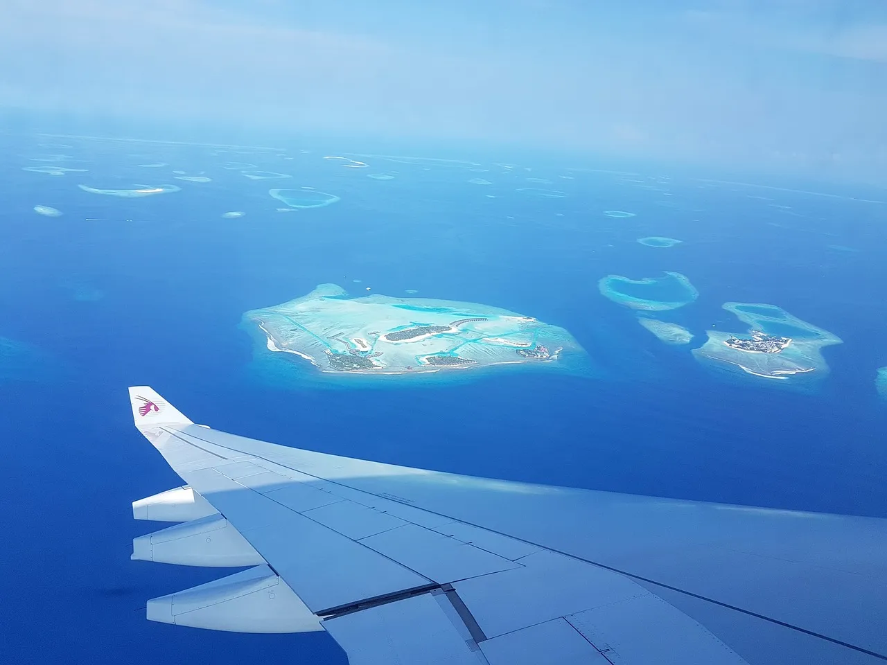 Sky View from a Plane Flight Over Maldive Island - Best Time to Visit Maldives - Planet Travel Advisor