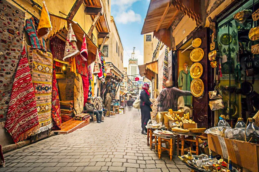 Stores in the medina streets of Fez, Morocco - Best Time to Visit Morocco - Planet Travel Advisor