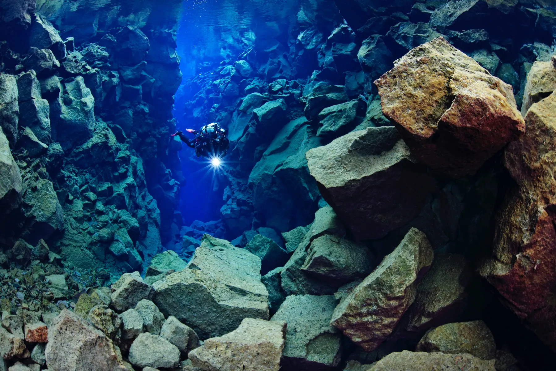 Silfra Fissure Arctic Adventures - Where to Travel in April - Planet Travel Advisor