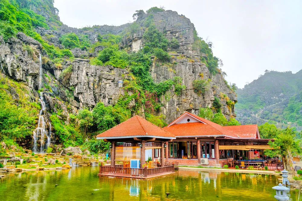 Waterfall at Hang Mua Cave - Planet Travel Advisor