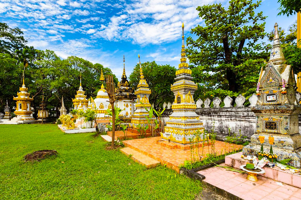 Small Stupas at Garden Near Gate, Wat Sisaket - Planet Travel Advisor Small Stupas at Garden Near Gate, Wat Sisaket - Planet Travel Advisor