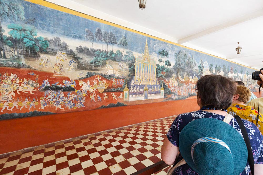 Tourists Looking at Ancient Wall Paintings at the Royal Palace, Phnom Penh - Planet Travel Advisor Tourists Looking at Ancient Wall Paintings at the Royal Palace, Phnom Penh - Planet Travel Advisor