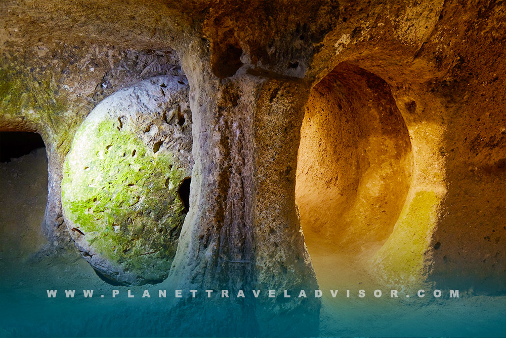 Kaymakli Underground City Low Ceiling Tunnel Lighting - Planet Travel Advisor.jpg